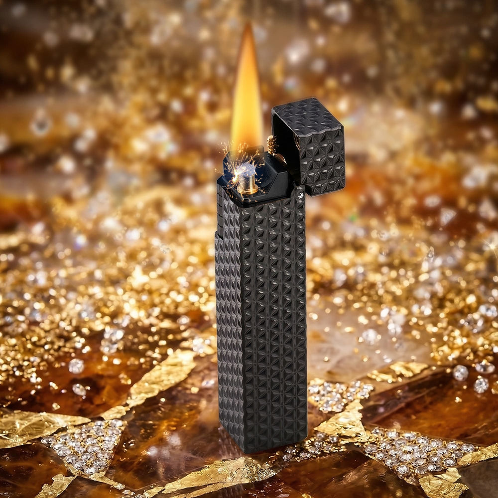 Thorens Side Slip rectangular lighter in black starburst pattern igniting with bright flame and spark, lid open to reveal precision ignition mechanism.