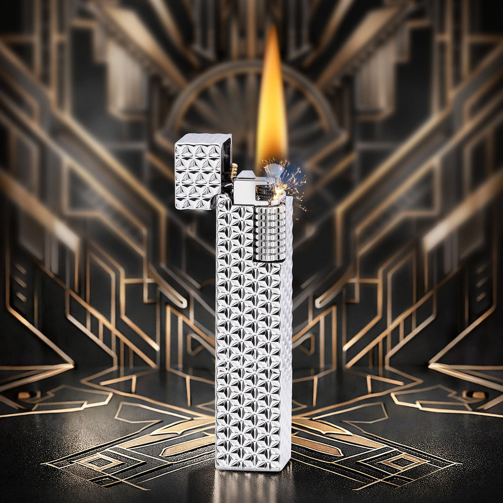 Thorens Side Slip rectangular lighter in silver starburst pattern igniting with bright flame and spark, lid open to reveal precision ignition mechanism.