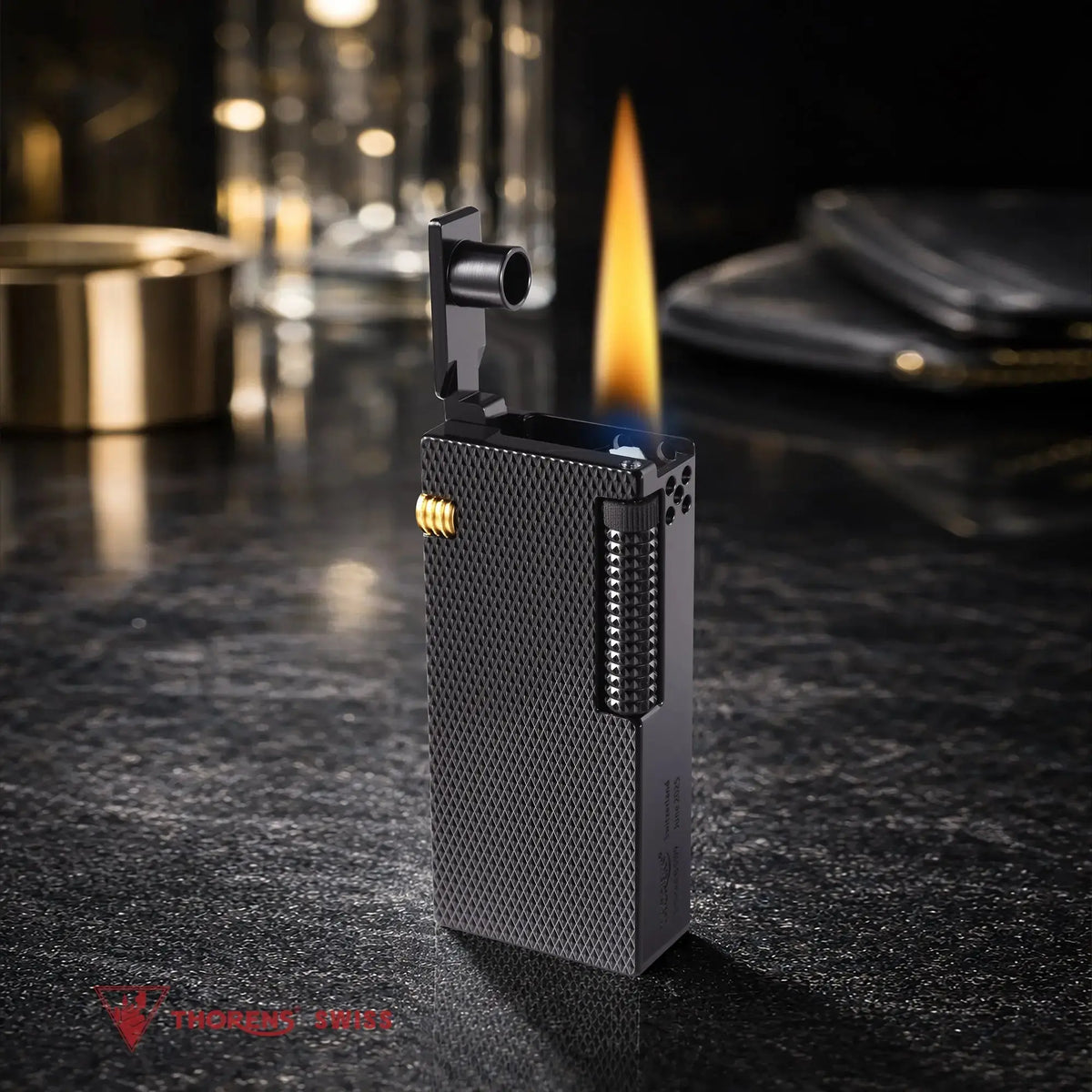 Thorens Slim Cube Black Mesh lighter standing open with flame lit, featuring a textured black brass body, side ignition roller, and refined mechanical profile in a premium tabletop setting