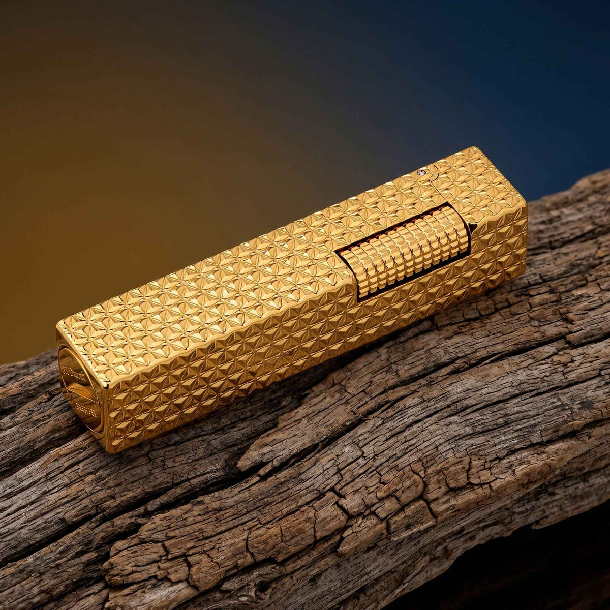 Thorens rectangular lighter with gold starburst pattern and extended roller shown closed, highlighting engraved brass texture and precision side-slide ignition wheel.