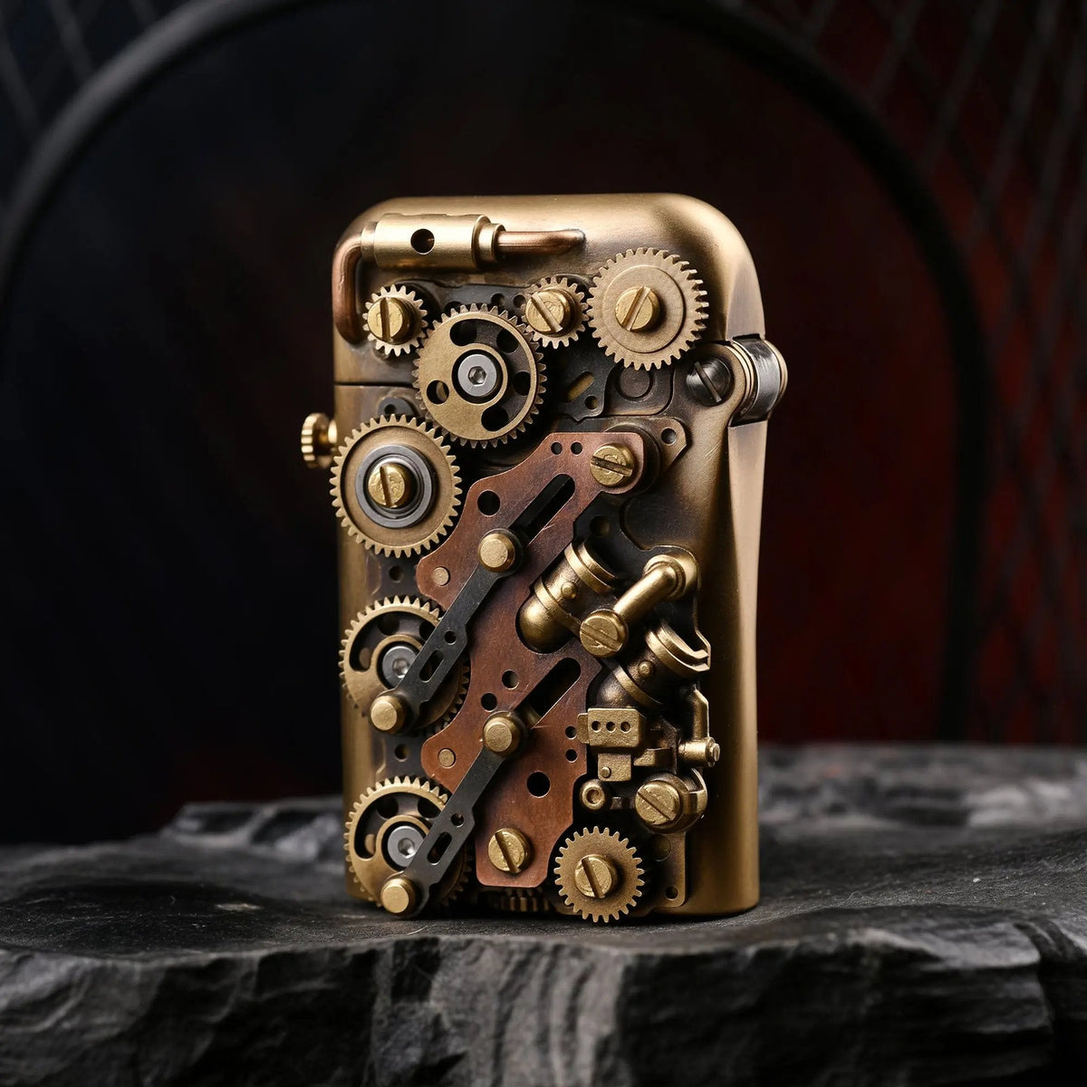 A close-up of the Thorens Steampunk-Twin Torque bottom-fill lighter, displaying its industrial brass gears and copper accents on a rugged stone surface.