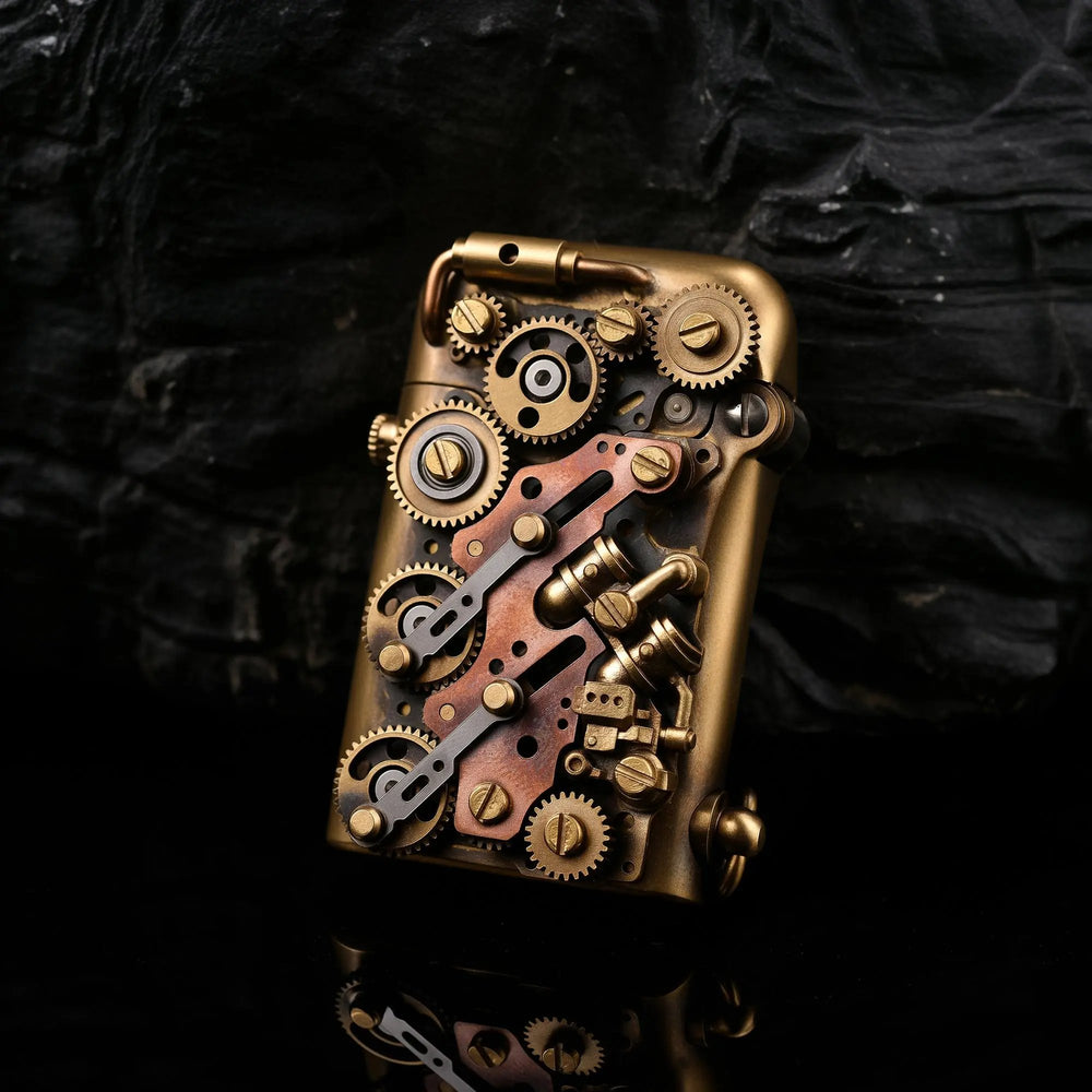 A Thorens Steampunk-Twin Torque side-fill lighter featuring an intricate array of mechanical brass and copper gears and pipes against a dark rock background.