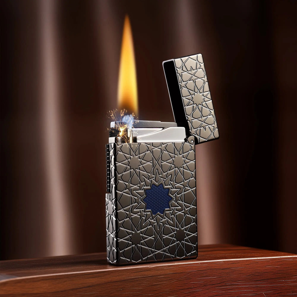 A Thorens Stellar Mesh Black lighter with an open lid and active flame, showcasing the flint spark and intricate geometric star pattern.