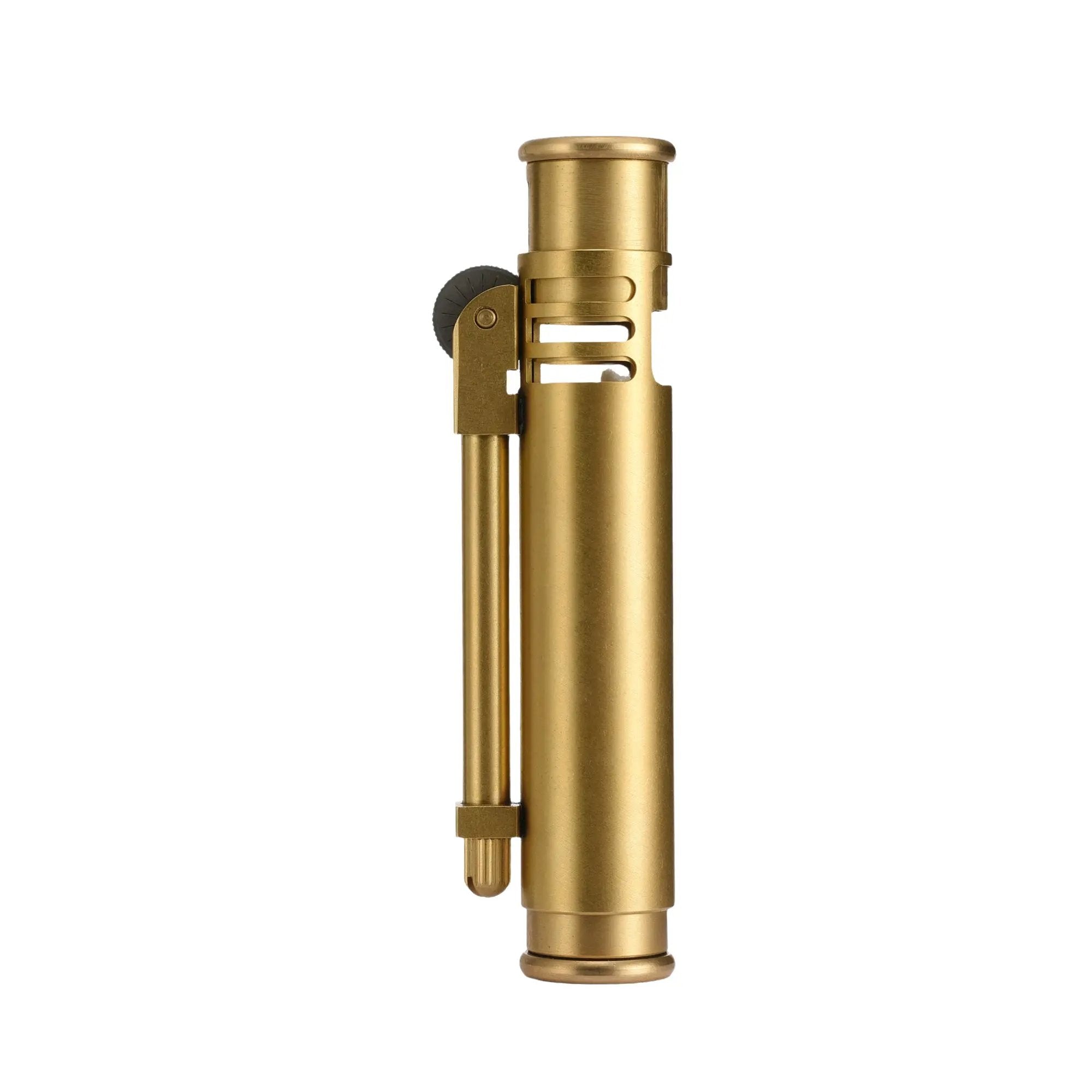 A vertical profile of the Torch Stick lighter in a brushed brass finish, highlighting its slim cylindrical body and precision mechanical flint arm.