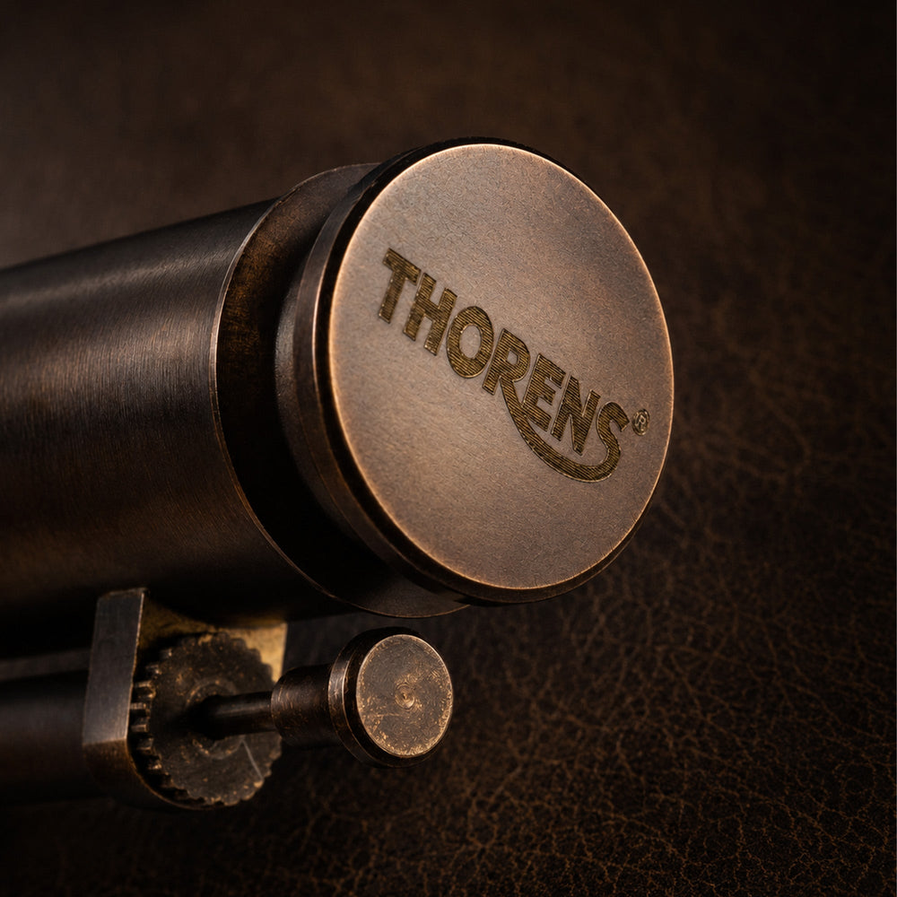 Close-up detail of the THORENS Trench Lighter Battle Soul Glossy, highlighting the engraved top cap, side ignition wheel, and dark textured background.