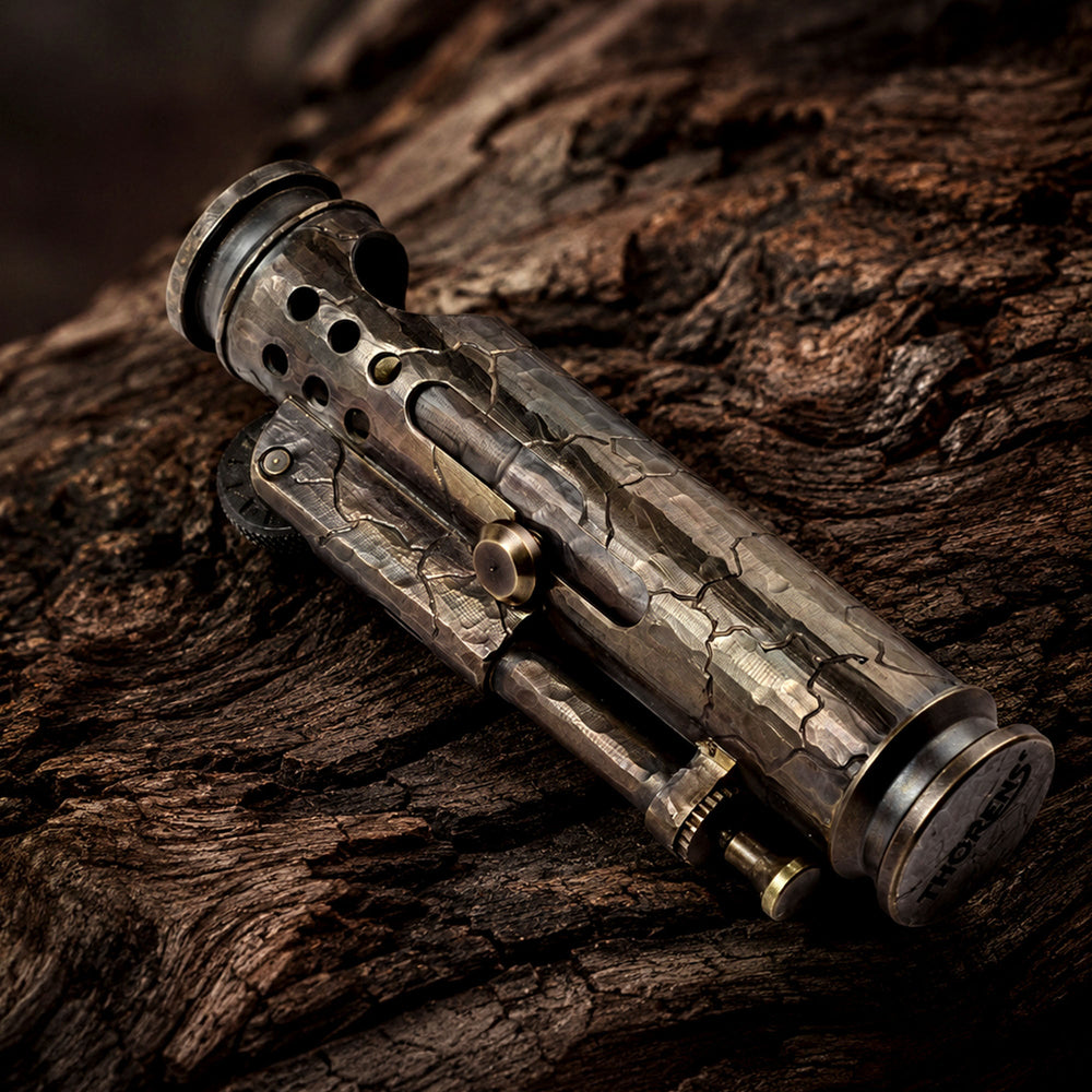 THORENS Trench Lighter Battle Soul Hand Carved Cracks resting on rugged tree bark, showcasing the hand-carved crack texture, aged metal finish, and detailed trench lighter structure.