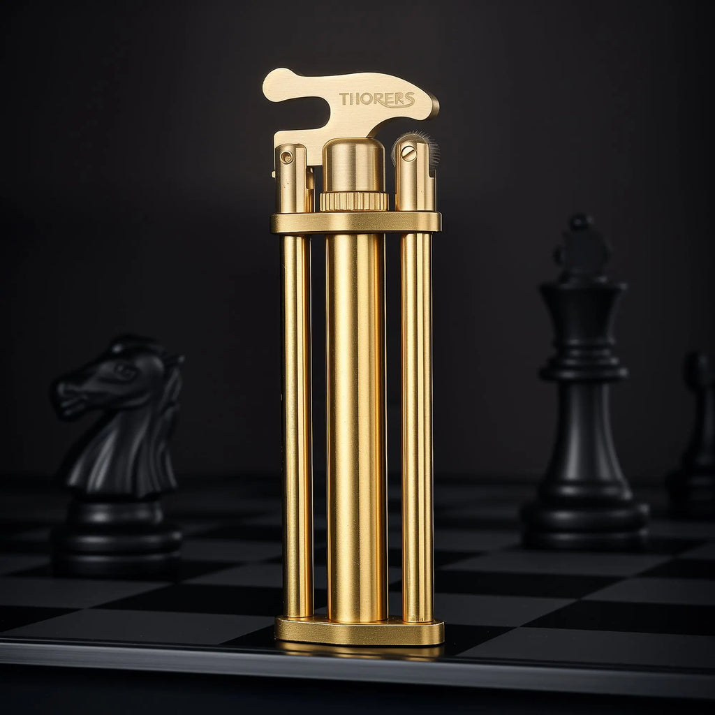 A vertical view of the Three-Section Stick Lighter in brushed brass, showcasing its slender mechanical pillars and engraved top cap on a chessboard.
