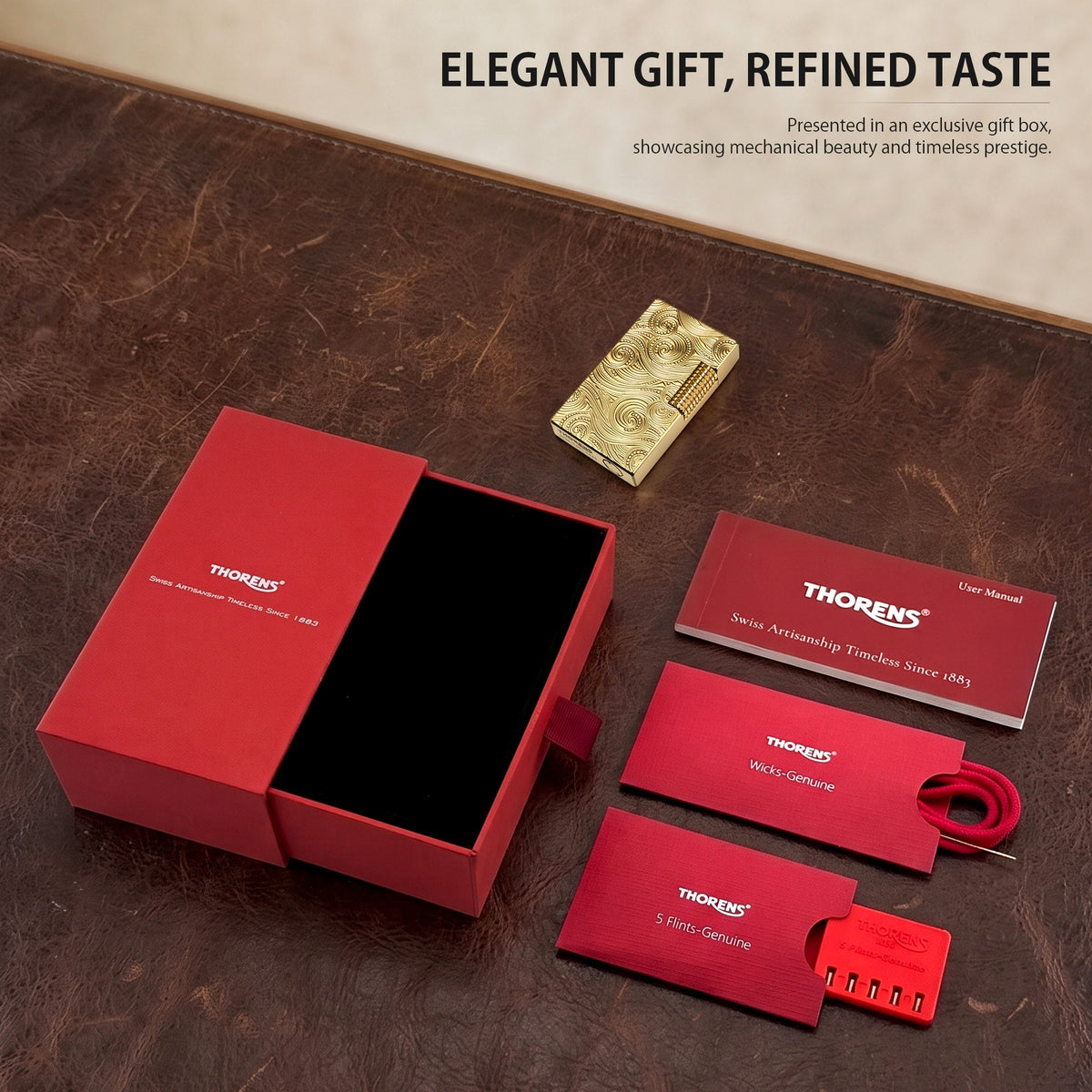 An overhead view of the Thorens gold vortex lighter product set, including the premium red gift box, replacement wicks, a pack of five flints, and the user manual.