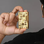A person holding a Thorens gold vortex engraved lighter, demonstrating its compact size and ergonomic design for comfortable everyday carry.