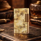 A premium Thorens gold lighter featuring deep vortex engravings and a textured side-slip roller, standing upright on a leather surface in a refined study setting.